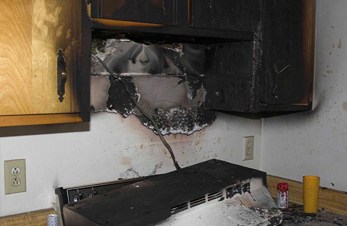 Fire damage restoration services in action in the image.
