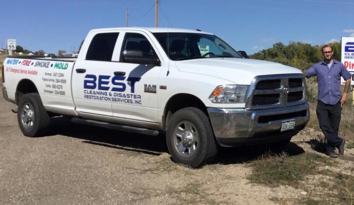 Best CDRS Company expert standing next to service vehicle on the roadside