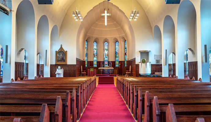 Bright and clean church interior polished floor and tidy seating