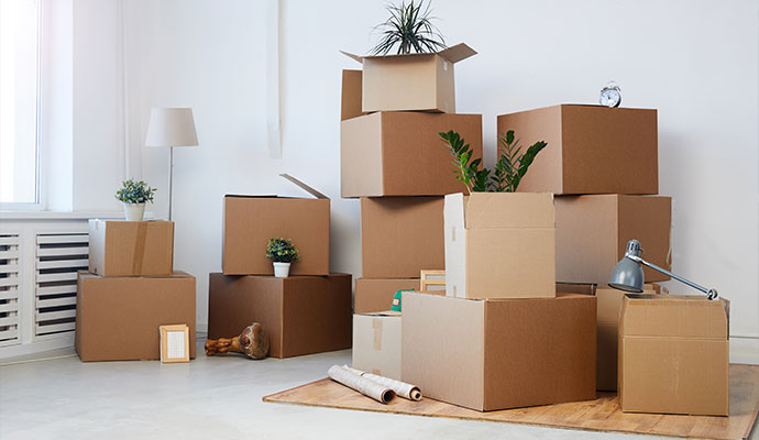 Cardboard moving boxes stacked in room