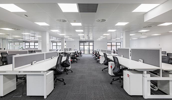 Clean office interior with neatly organized tables and chair