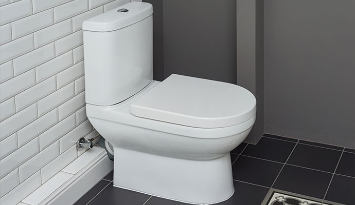 Clean white ceramic toilet in bathroom