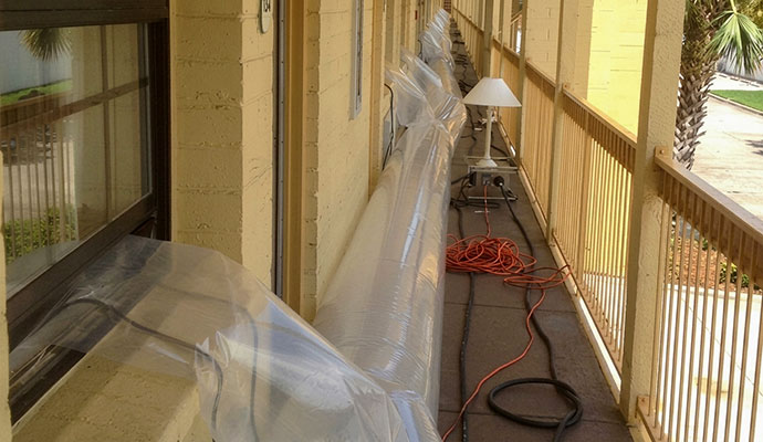Commercial drying equipment and setup in a hotel corridor