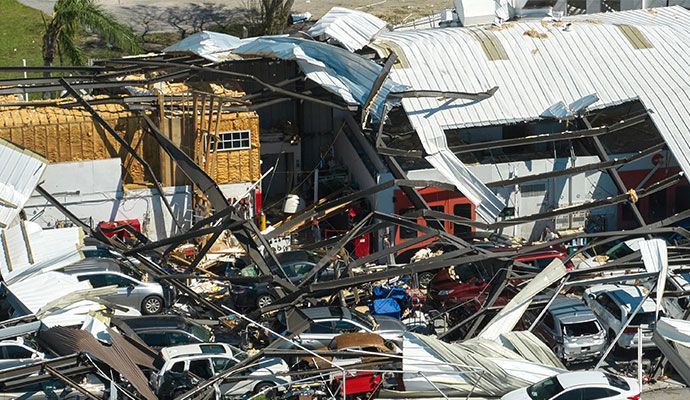 Disaster damage in  commercial area with debris and structural impact