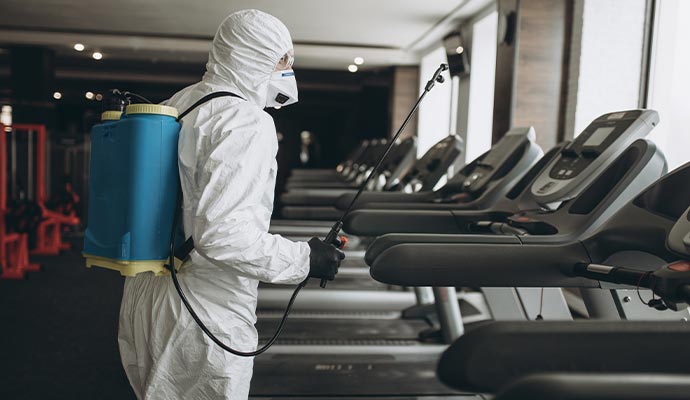 Professional disinfecting and sanitizing service on fitness center Professional disinfecting service on fitness center