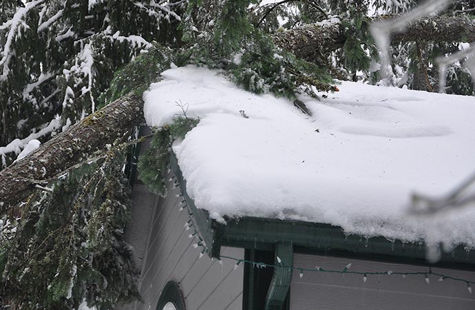 Heavy snow and ice on the roof in Durango