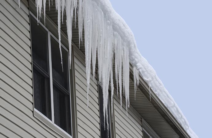 Ice damming causes damage to the gutter in Durango & Farmington