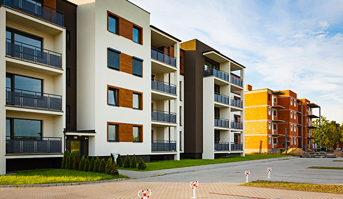 Modern multi story apartment building with balconies