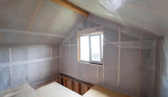 A room sealed with professional-grade plastic containment for mold remediation and structural restoration