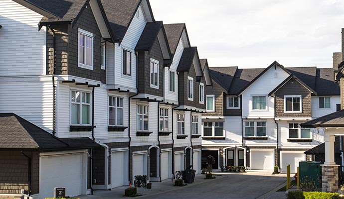 Modern townhouse complex featuring multiple residential units in a row