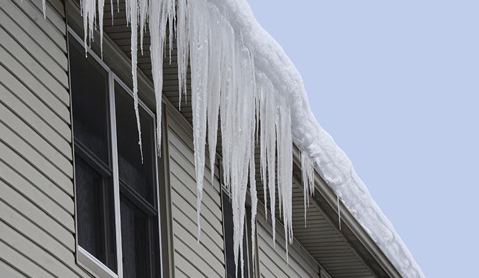 Ice hanging from house gutter