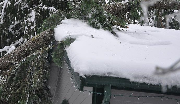 Snow damaged house roof