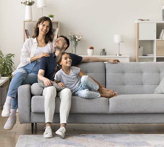 A happy family relaxing on a sofa