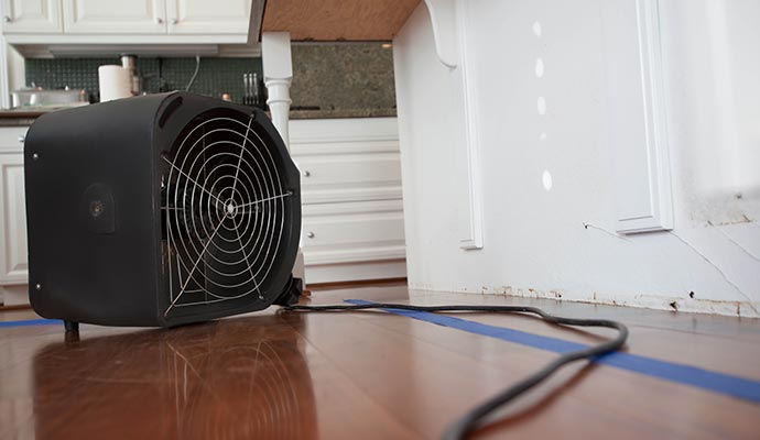 Flood damage restoration equipment on floor Flood damage restoration equipment set up on the floor for water cleanup