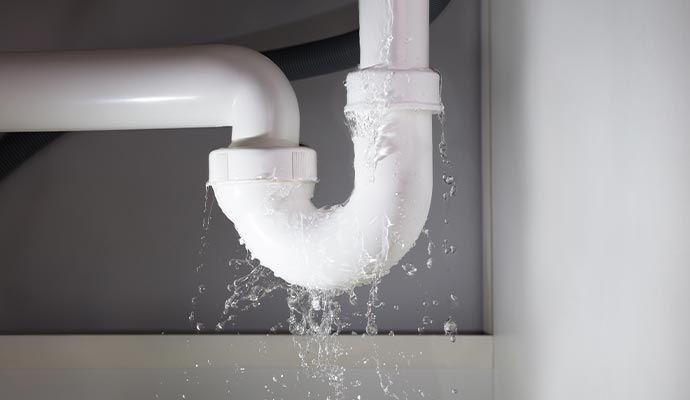 Plumbing pipe overflowing and spilling water