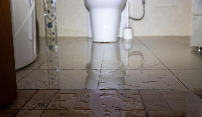 Water leaking in bathroom floor