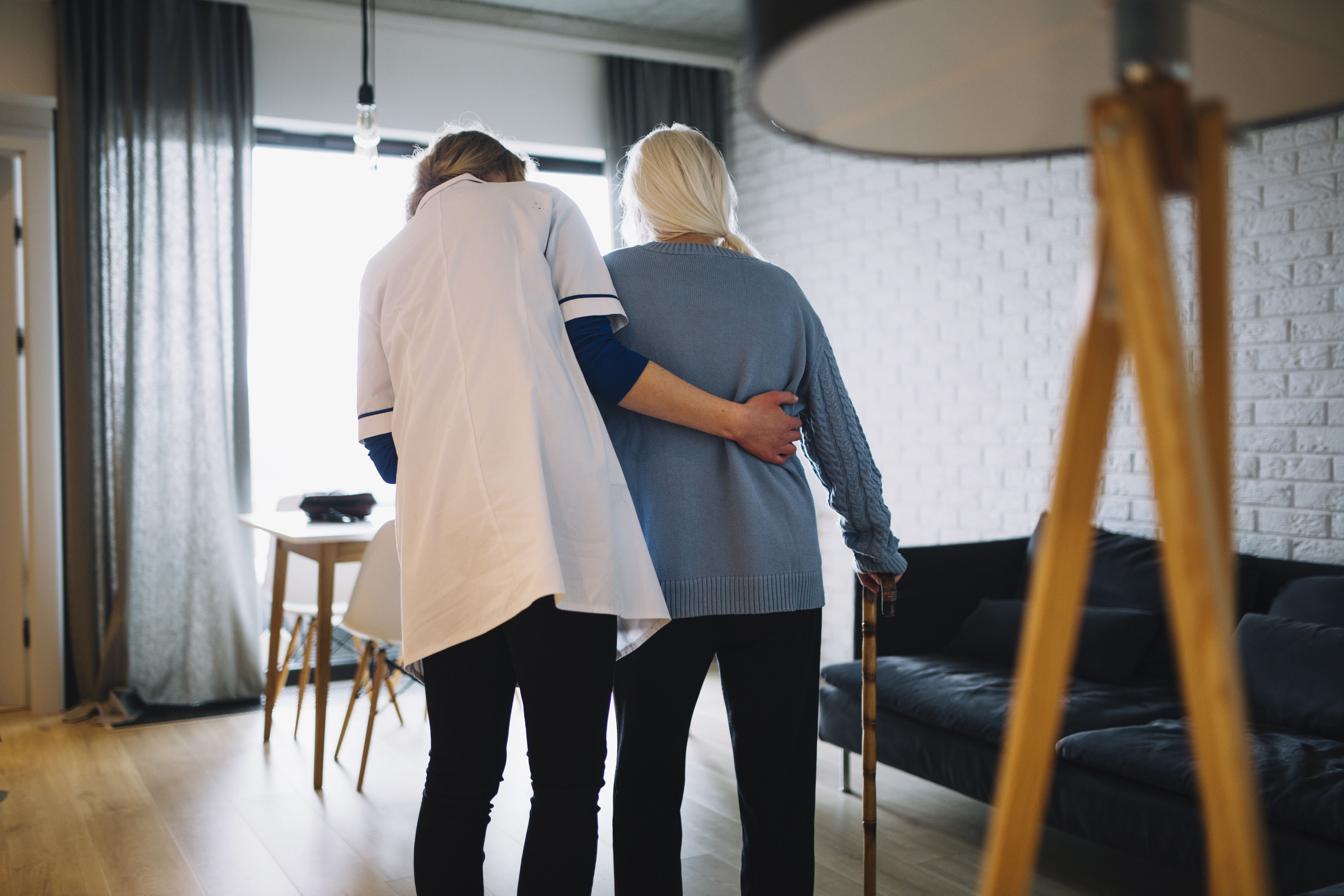 Women Walking With Nurse